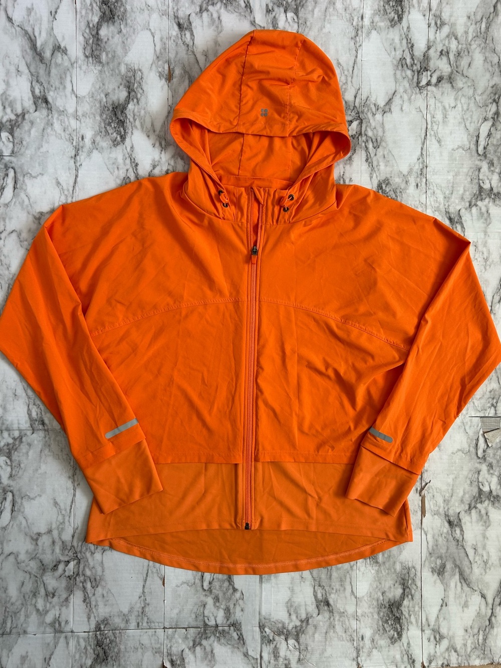 Sweaty Betty women’s XXL Fast Track Running Jacket in tangerine orange color